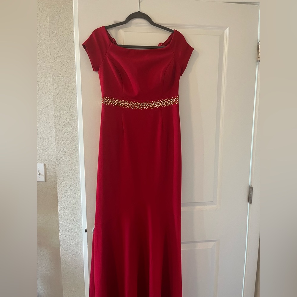 Red evening gown with gold embellishments